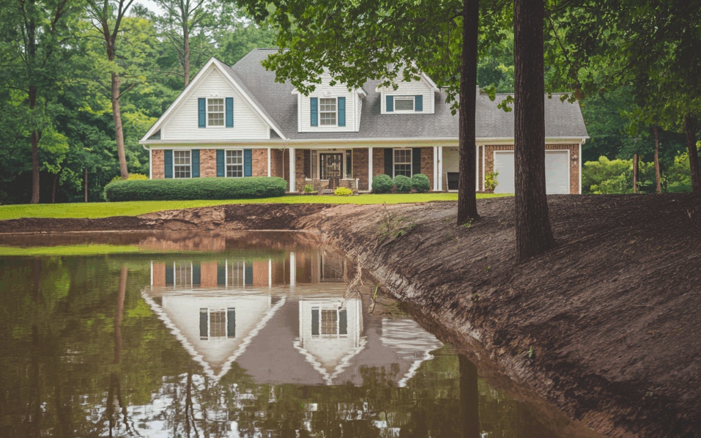 visible soil erosion and a downspout draining